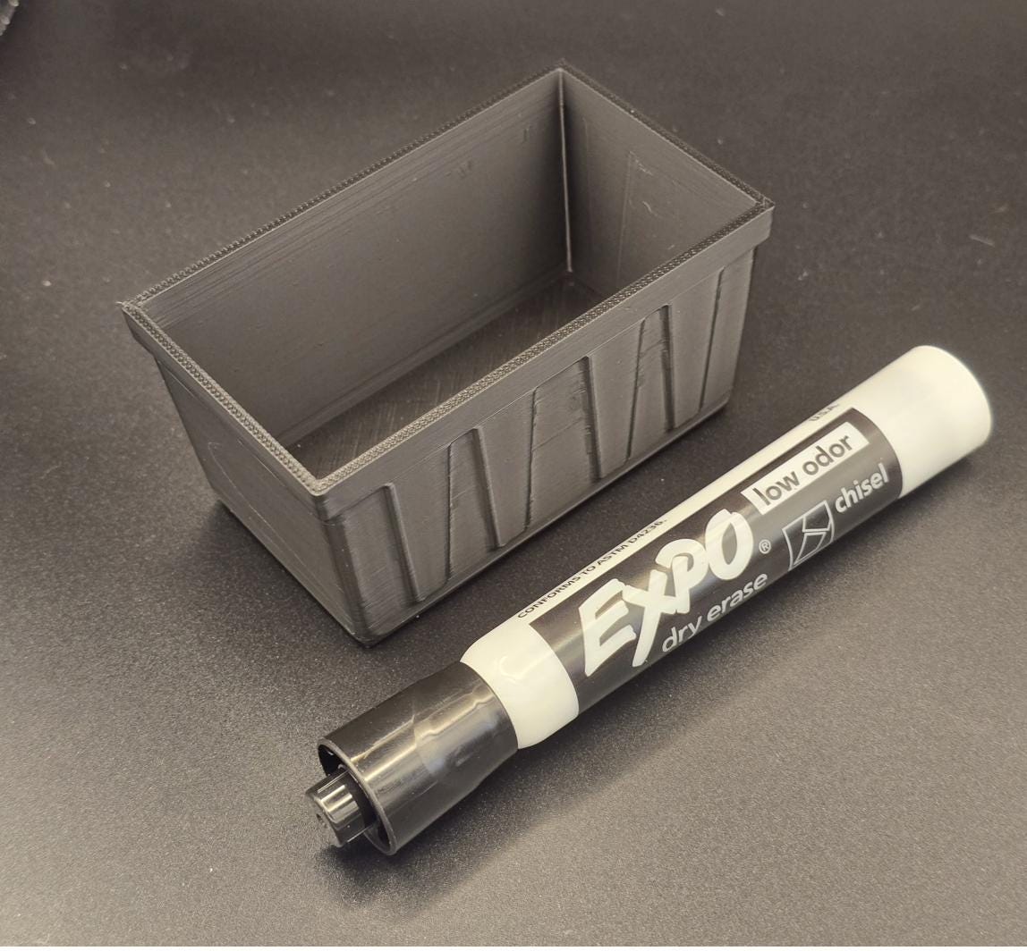 Black 3D printed mini tote bin with dry erase marker for scale, no lid