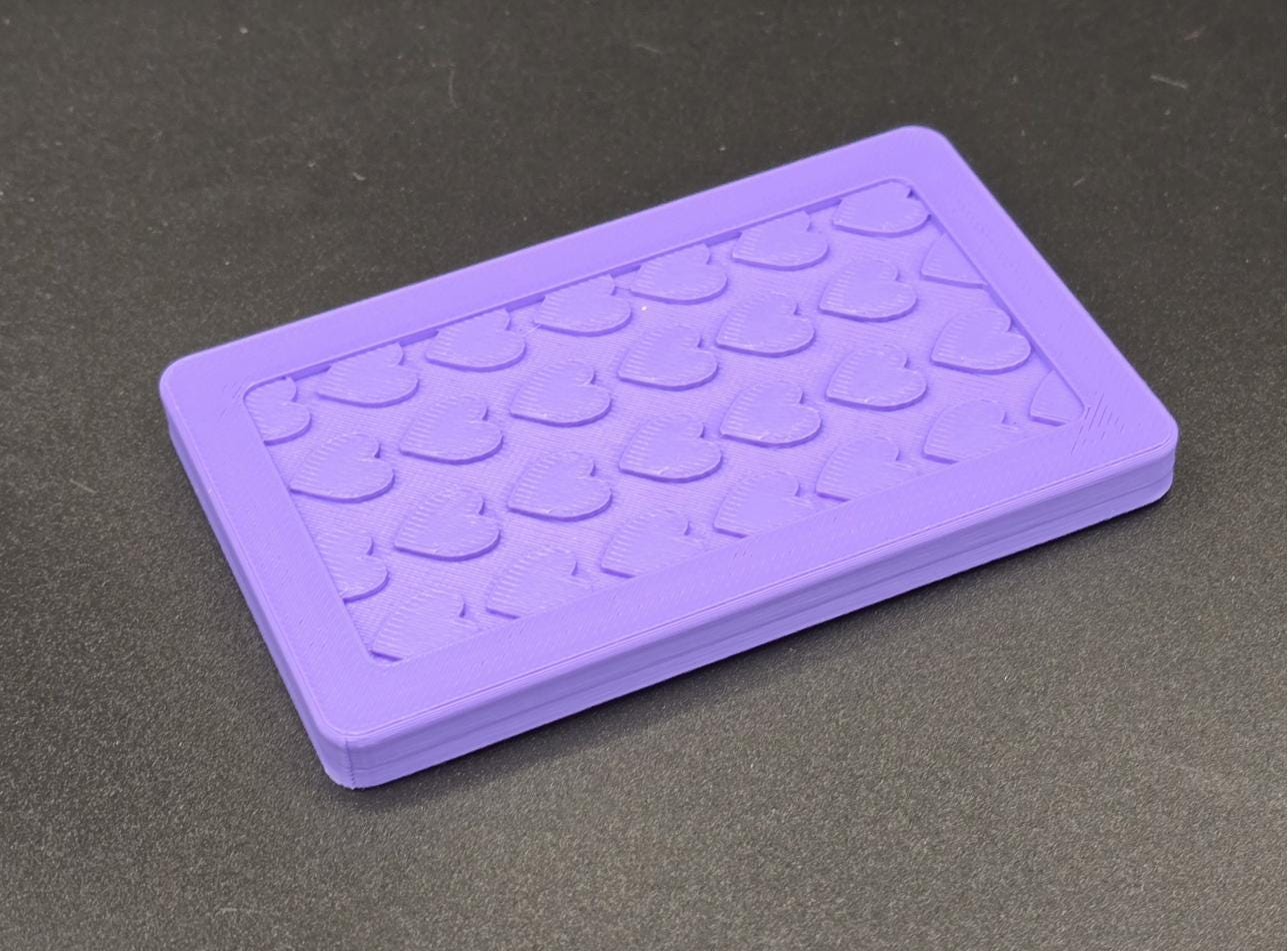Purple 3D printed mini tote lid with textured grip top, angled view