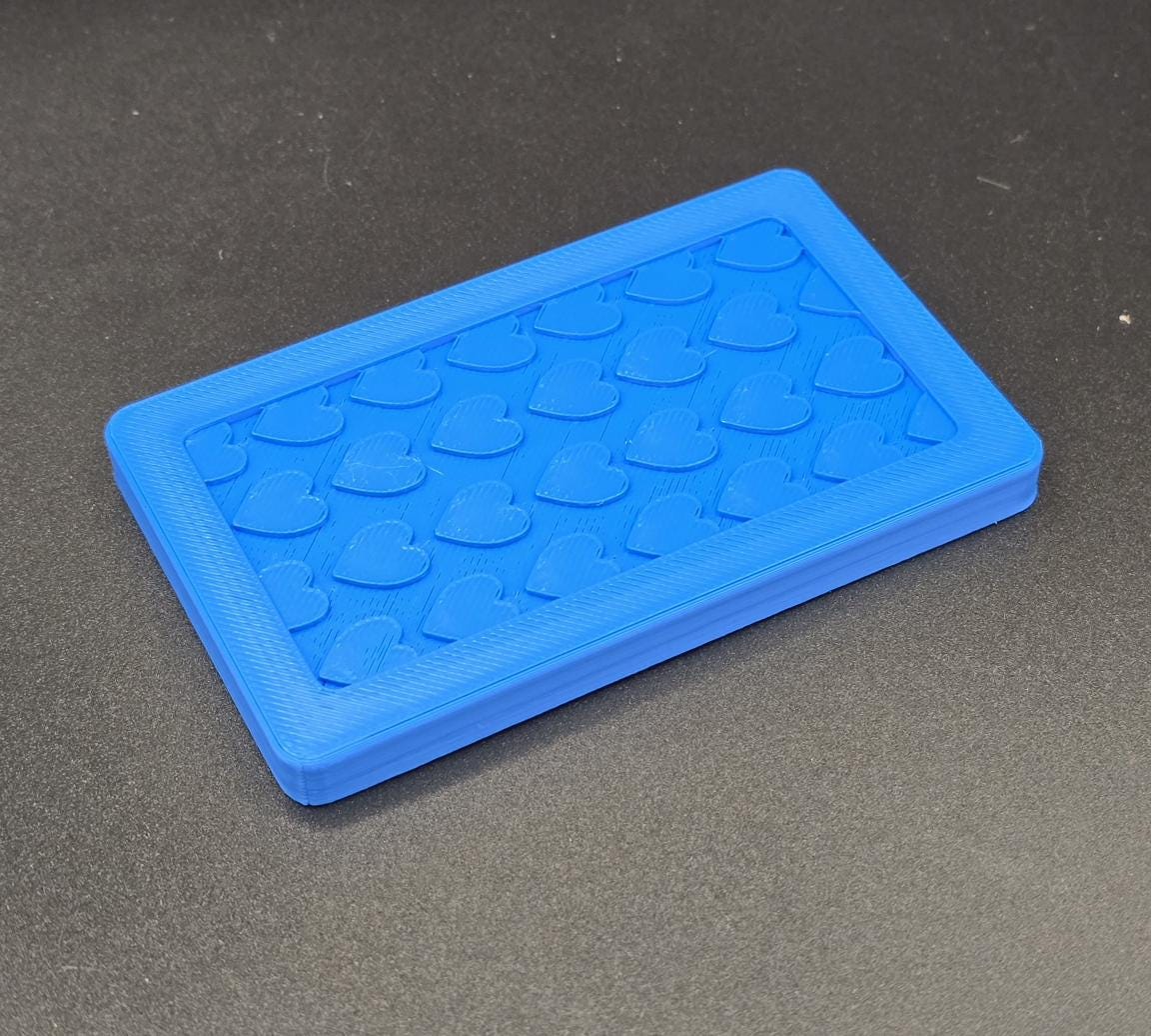 Blue 3D printed mini tote lid with textured grip top, angled view