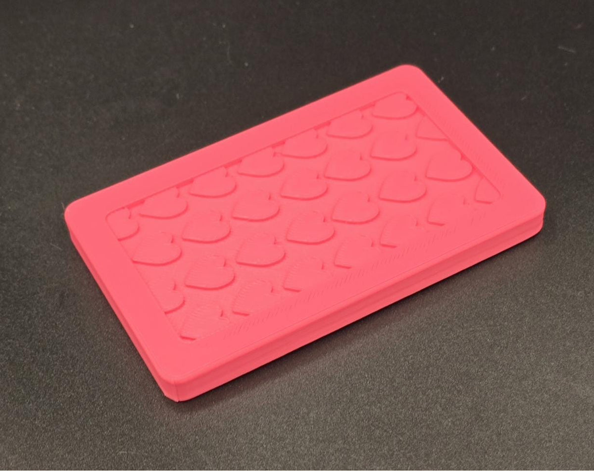 Pink 3D printed mini tote lid with textured grip top, angled view