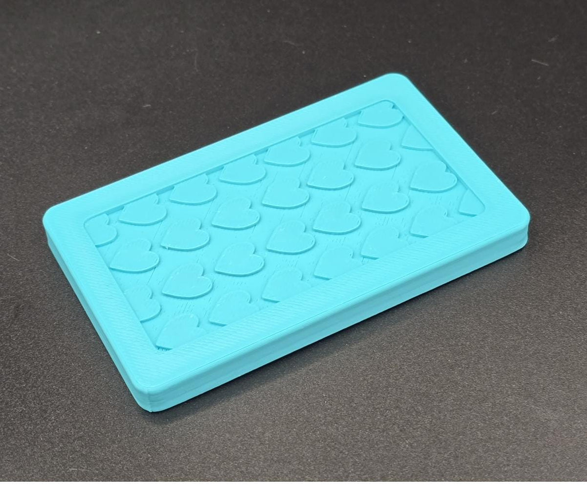 Turquoise 3D printed mini tote lid with textured grip top, angled view