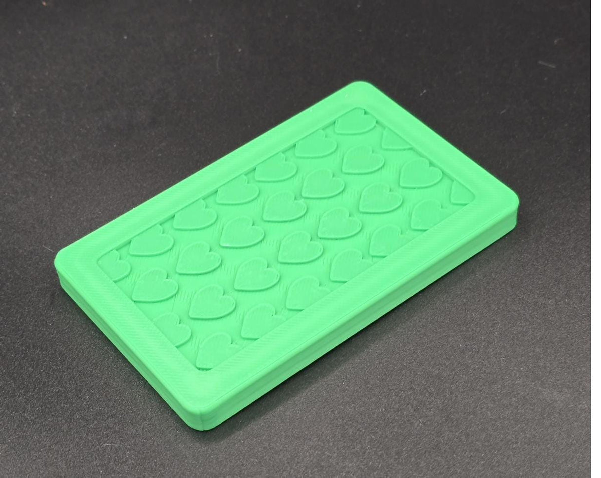 Green 3D printed mini tote lid with textured grip top, angled view